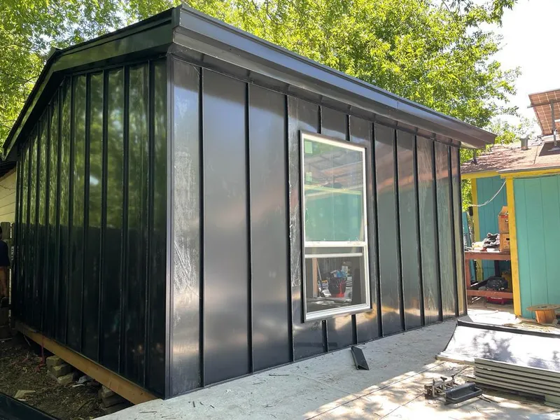 Black standing seam metal wall panels for Roof Inspection in Sinton